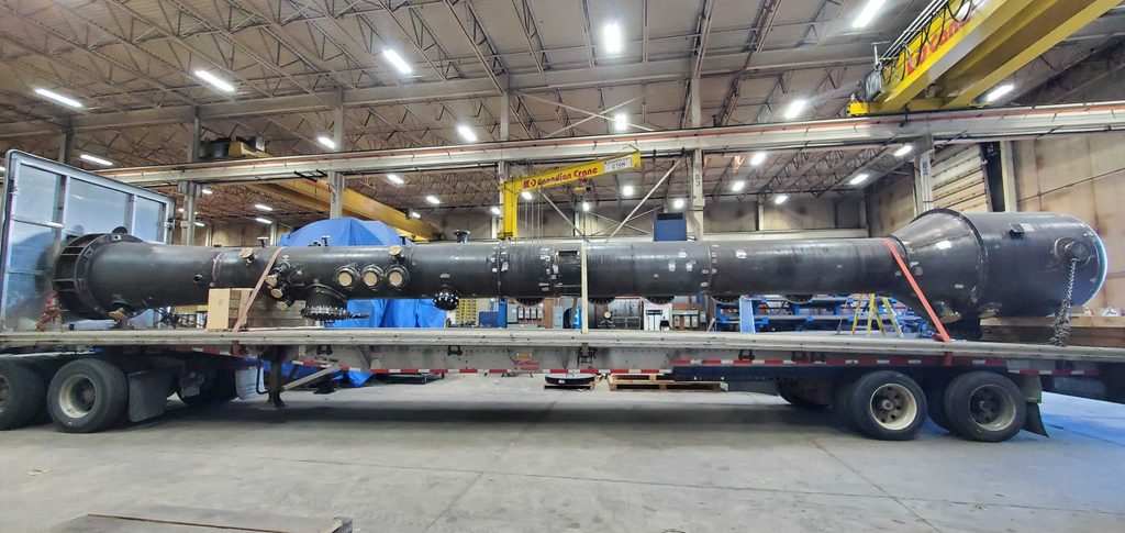 20260828_091208 Carbon steel custom pressure vessel for food and beverage industry on a flatbed trailer inside the Alps Welding shop