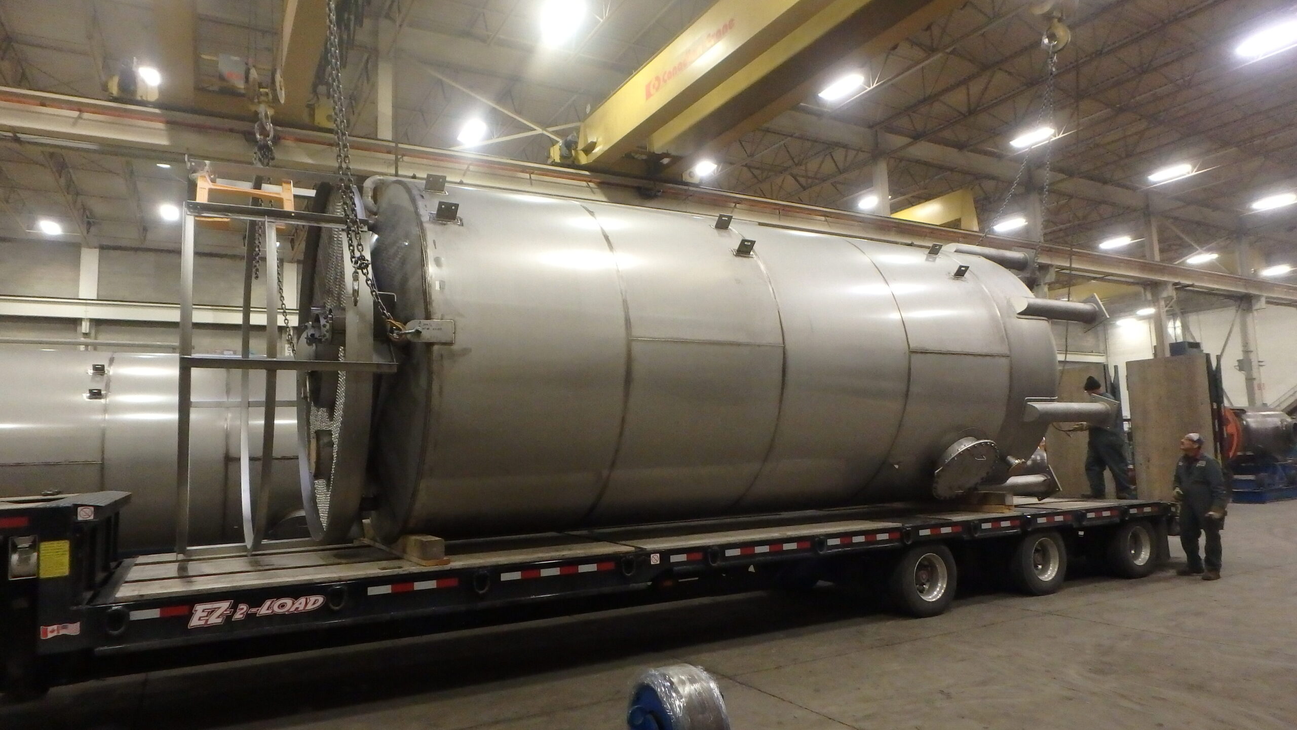 Custom stainless steel pressure vessel being transported for customer from Alps Welding's shop.